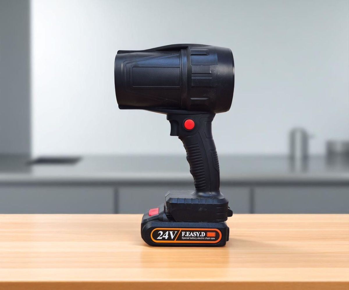 Cordless handheld spotlight on a wooden desk