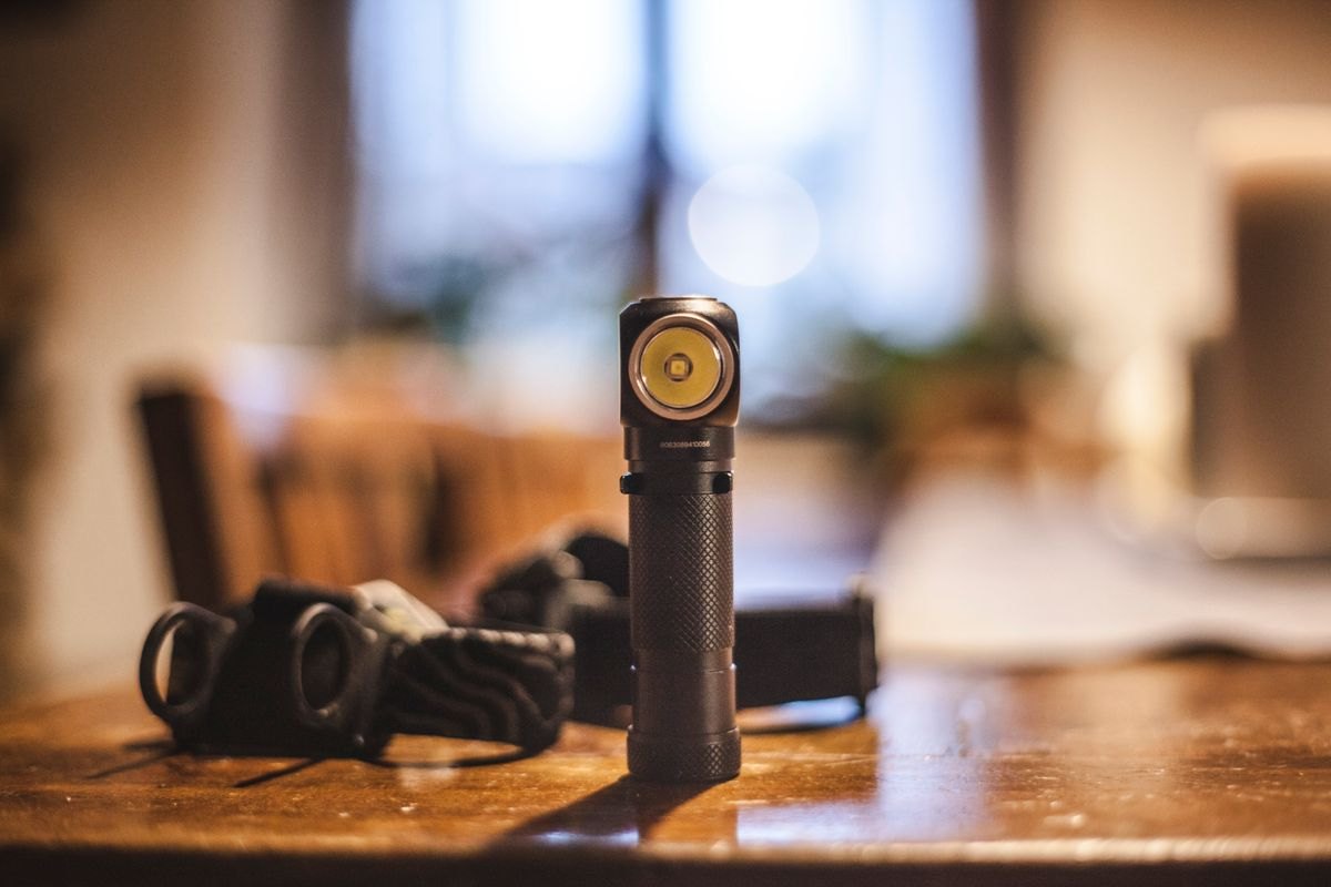 Small flashlight standing on an indoor table