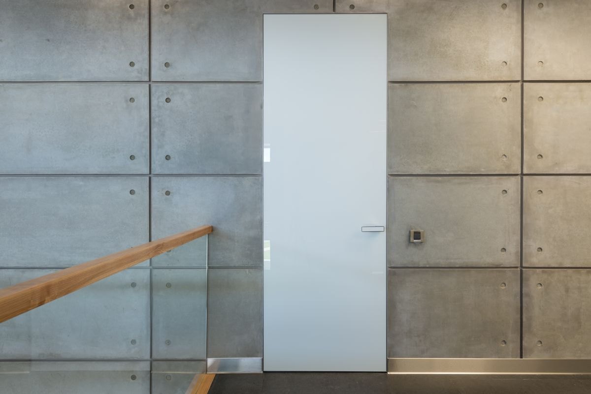 Interior hallway with a closed door and solid walls