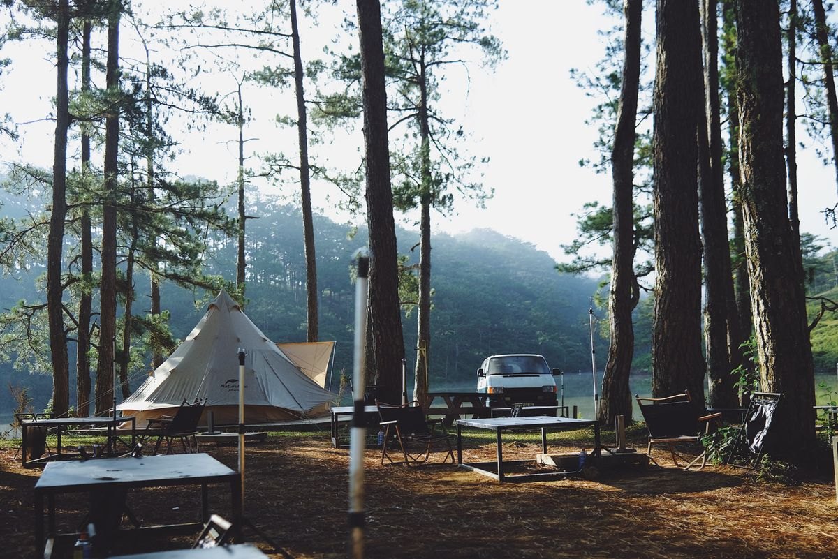 Established campsite with tent and parked vehicle