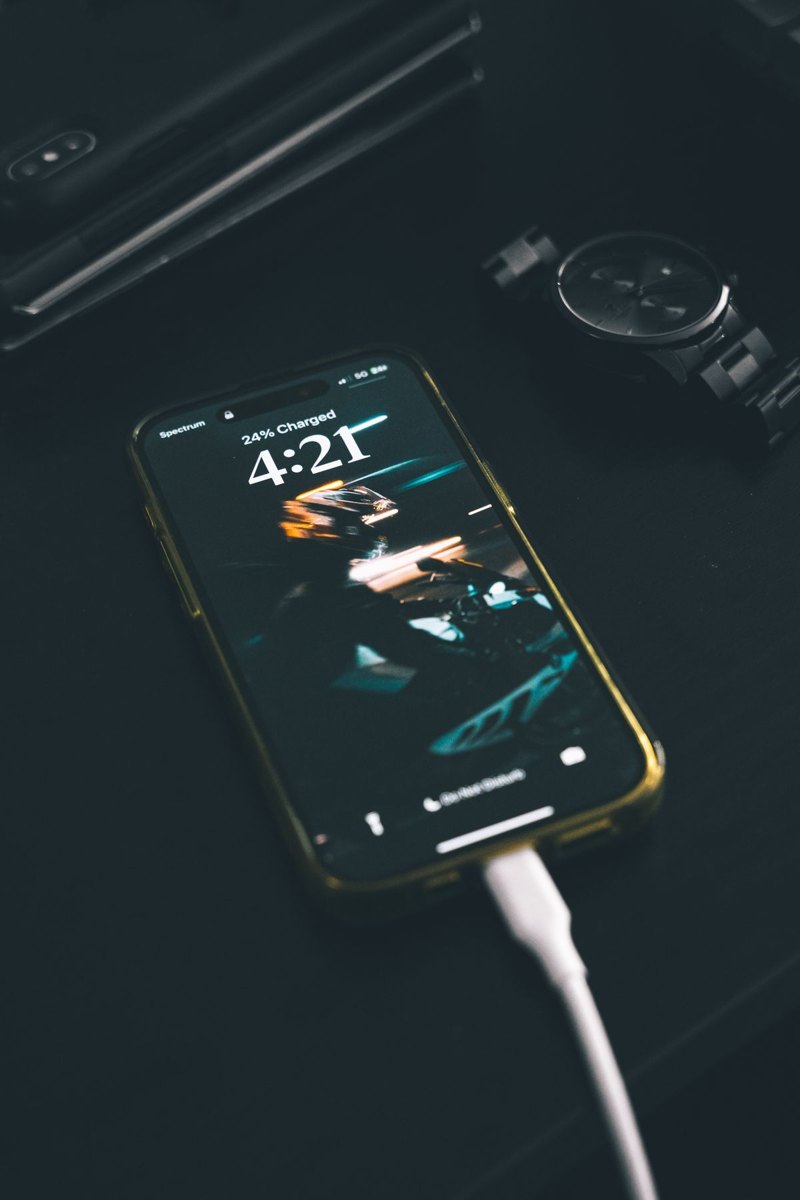 Phone charging through a cable on a table