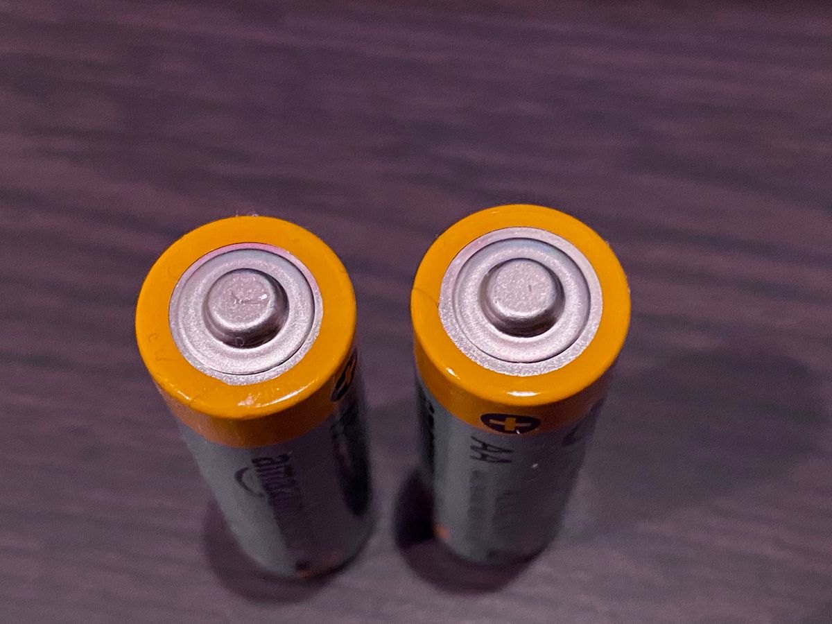 AA battery terminals ready for a condition check