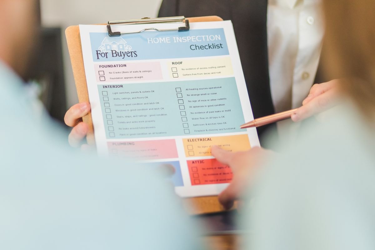 Clipboard with a household inspection checklist